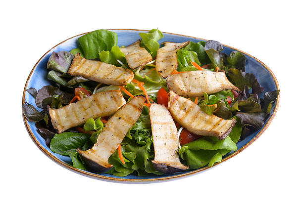 istock salad  Eringi mushrooms in plate on white background 625380112
