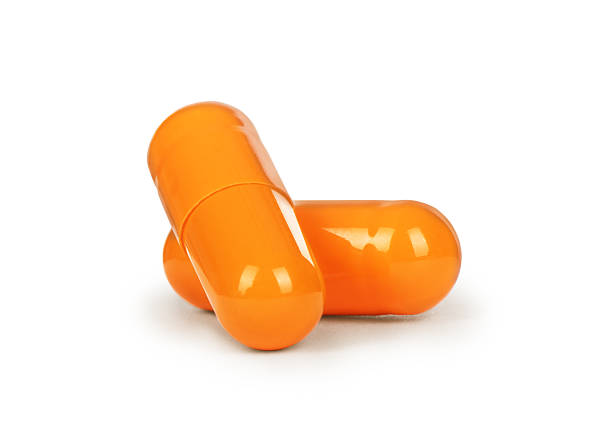 istock Close-up two medical capsules isolated on white background 625380318