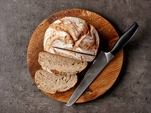 istock freshly baked bread and knife 625380496
