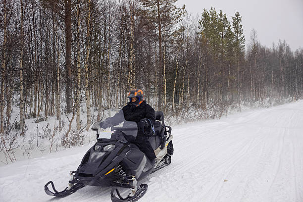 istock Man managing snowmobile in Ruka in Lapland 625382474