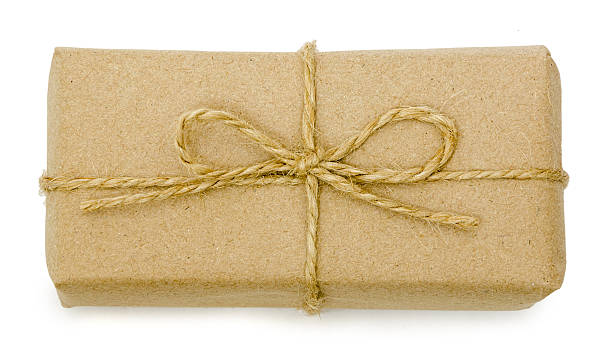 istock gift wrapping from Kraft paper wrapped with twine 625383076