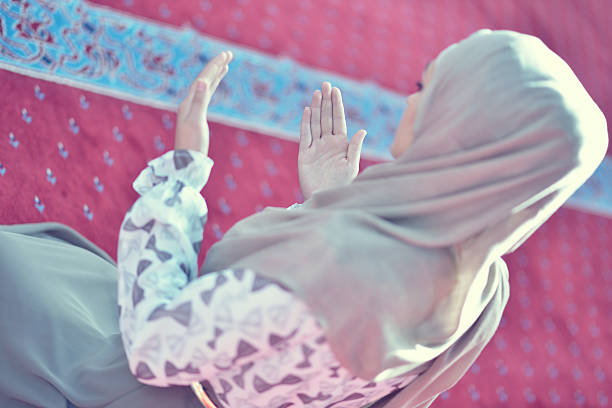 istock muslim woman praying in mosque 625383226