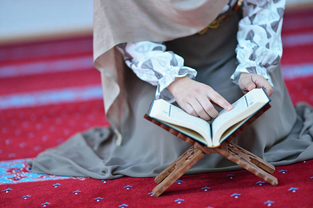 istock muslim woman praying in mosque 625383280