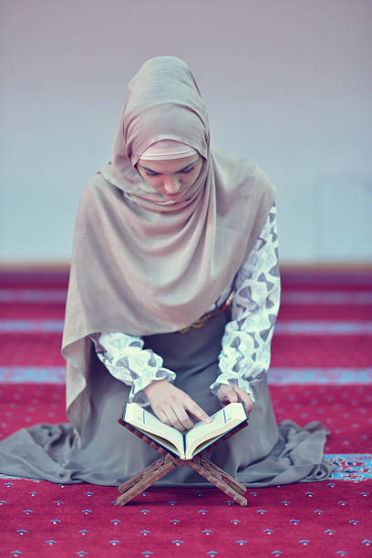 istock muslim woman praying in mosque 625383364