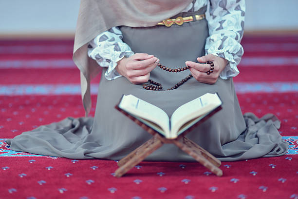istock muslim woman praying in mosque 625383822