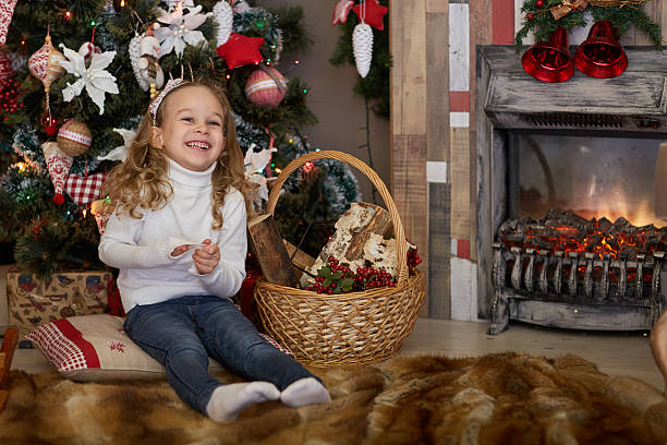 istock Happy girl near Christmas tree. 625384284