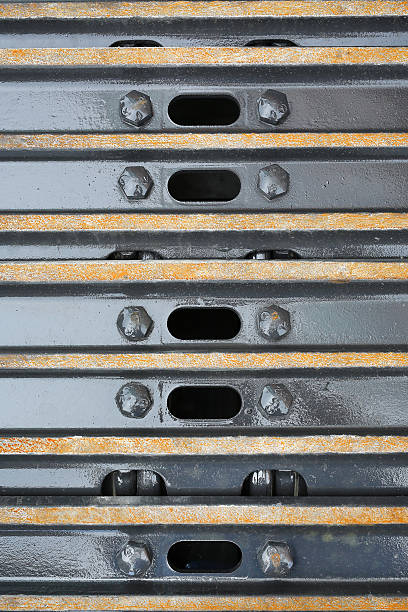 istock Close-up wheel of yellow track-type loader excavator 625385410