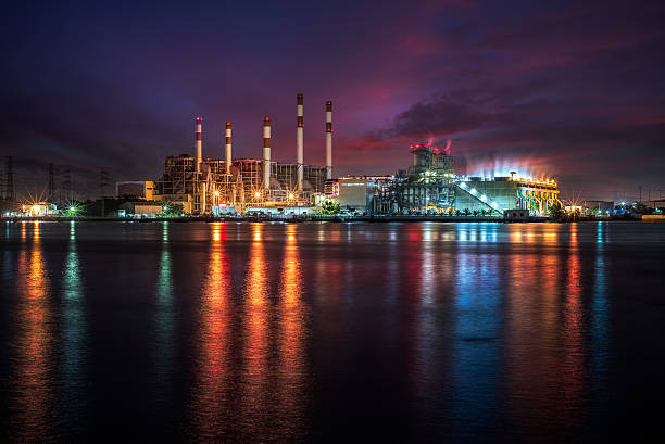 istock Power plant at dust with reflection over the river 625388426