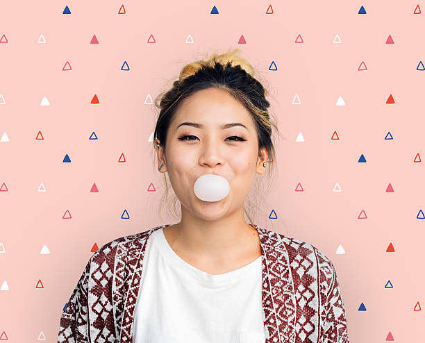 Young Girl Chewing Bubble Gum Concept