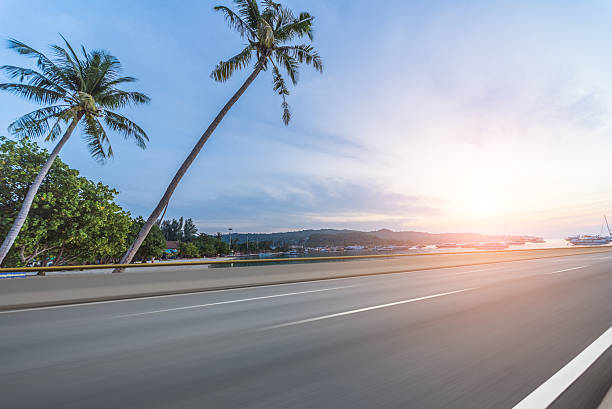 istock Asphalt road beside sea,Car Advertising background 625389580