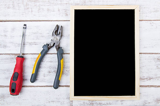 istock Blank blackboard and Set of repair hand tools. 625393968
