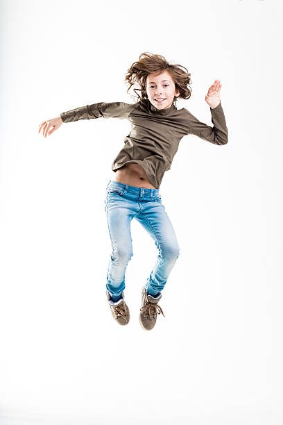 istock girl jumping light as like as a feather 625396626