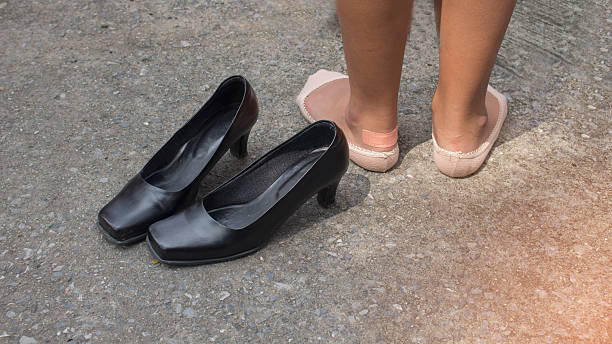 istock foot pain after, take shoes off 625396972