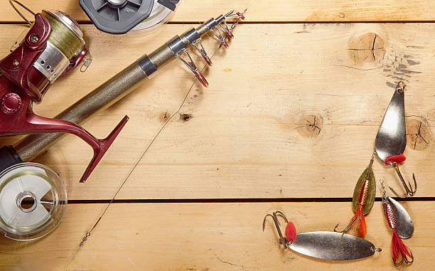 istock Fishing composition with angling equipment on wooden background 625406398