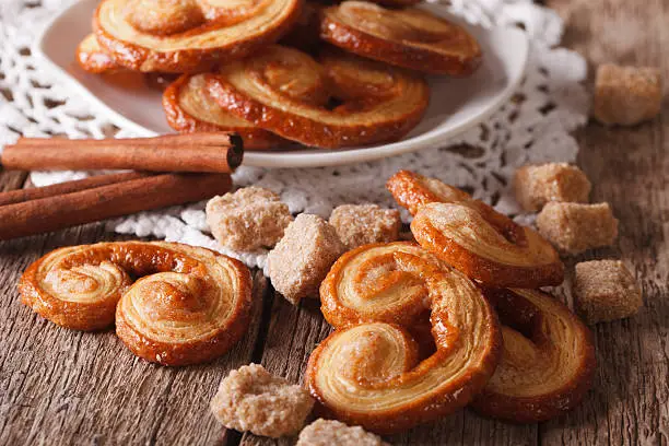 Tasty cookies Palmiers with sugar and cinnamon on the table close-up, horizontal