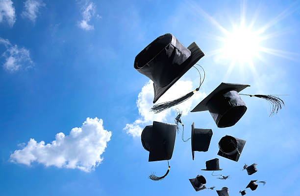 Graduation Ceremony, Graduation Caps, hat Thrown in the Air with Graduation Ceremony, Graduation Caps, hat Thrown in the Air with bluesky abstract background. graduation throwing cap stock pictures, royalty-free photos & images