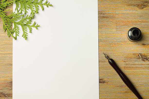 istock Fully visible blank sheet of paper with green thuja over 625409120