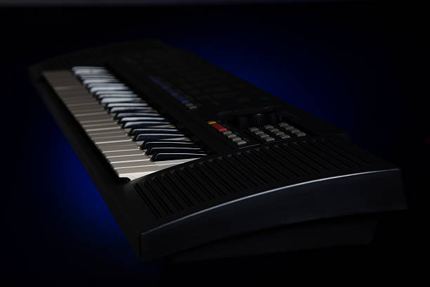 istock electric piano in black background 625411984