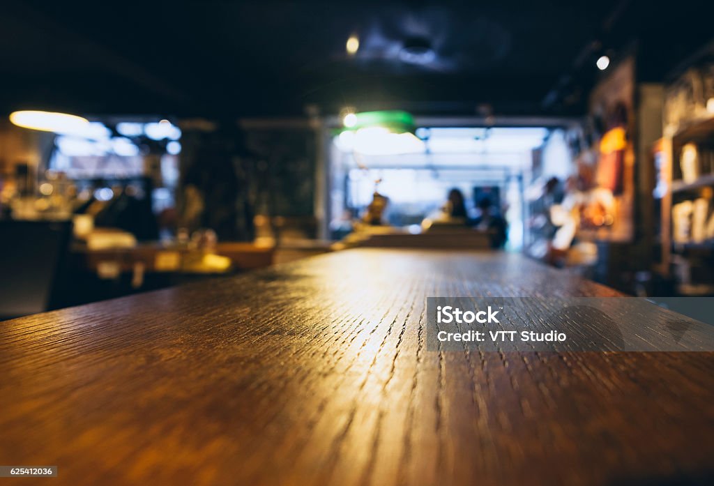 Table top Blurred People in Bar Cafe Restaurant Table top Counter Blurred People in Bar Cafe Restaurant Interior Bar - Drink Establishment Stock Photo