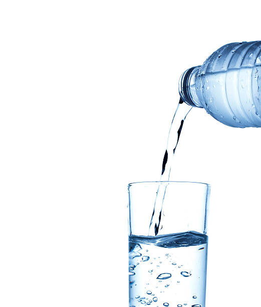 istock Pouring water from bottle into glass 625412314