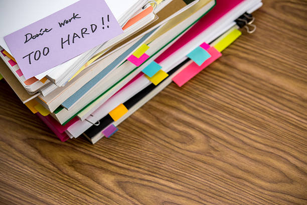 istock Don't Work Too Hard; The Pile of Business Documents 625412616