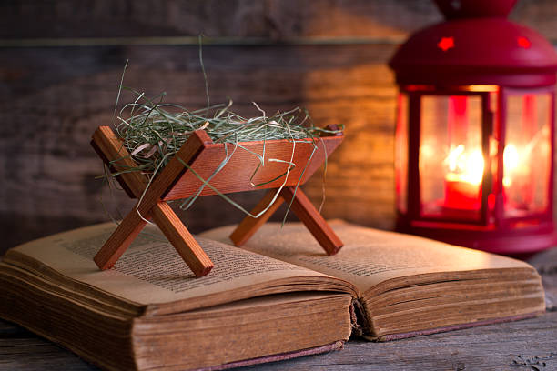 istock Birth of Jesus with manger on the bible 625413016