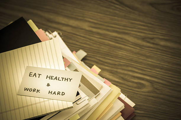 istock Eat Healthy Work Hard; The Pile of Business Documents 625413752