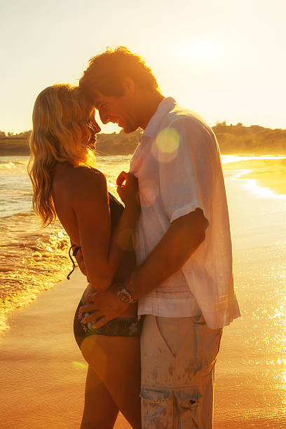 istock Romantic Couple on Beach at Sunset 625416082