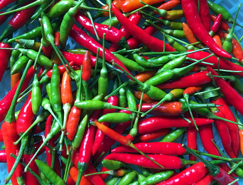 Thai fresh chili peppers red, green, orange