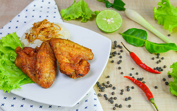 istock fried chicken with sticky rice on wooden background. 625417770