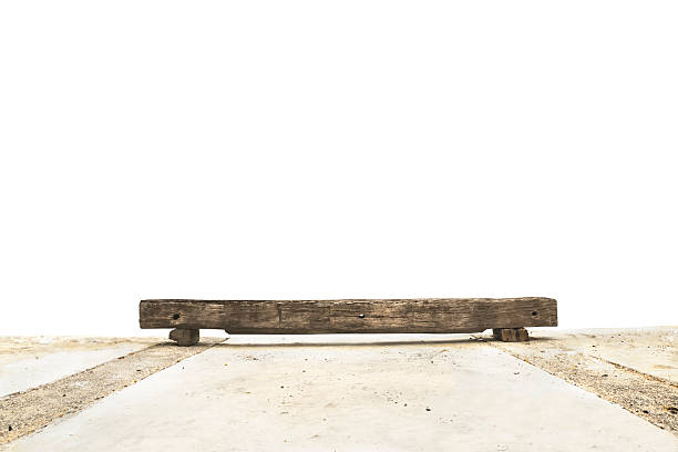 Old grunged long chair over concrete ground isolated on white