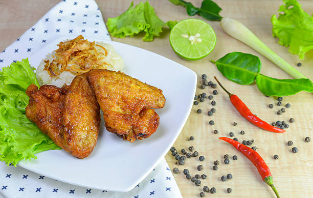 istock fried chicken with sticky rice on wooden background. 625426396