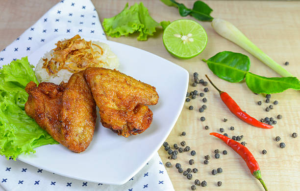 istock fried chicken with sticky rice on wooden background. 625426740