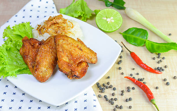 istock fried chicken with sticky rice on wooden background. 625426968