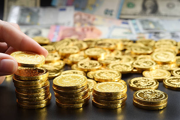 istock hand deliver a stack of coins in the form of graph 625432070