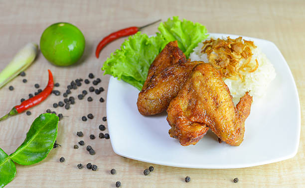 istock fried chicken with sticky rice on wooden background. 625432150