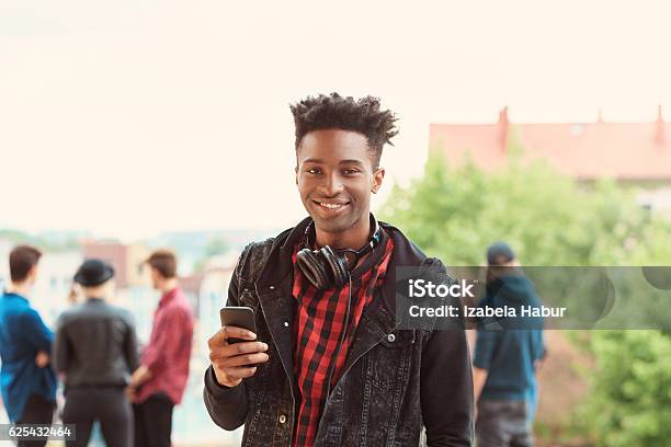 Afro American Young Guy Smiling Outdoor Stock Photo - Download Image Now - Youth Culture, Cool Attitude, African Ethnicity