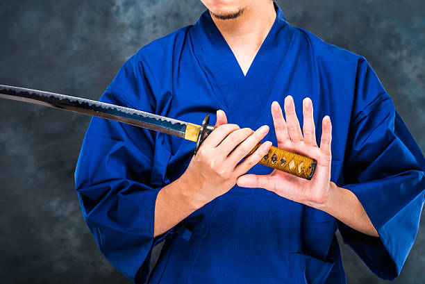 日本刀と男 - samurai katana chinese ethnicity men ストックフォトと画像