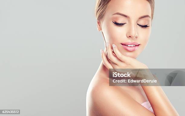 Young Smiling Woman With Clean Fresh Skin Stock Photo - Download Image Now - Healthcare And Medicine, Beauty, Spa Treatment