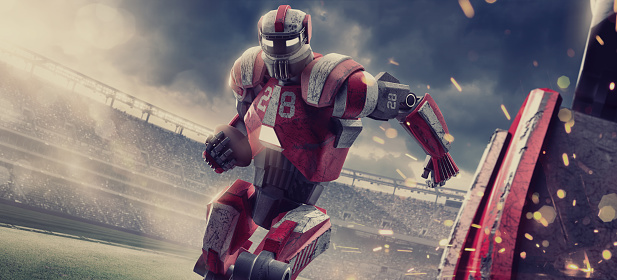 A conceptual image of a futuristic hi tech robot playing American football. The robot is running with an American football close to a team mate with sparks flying. The action takes place during a game of American football in a generic outdoor floodlit stadium full of spectators under a dramatic evening sky. 