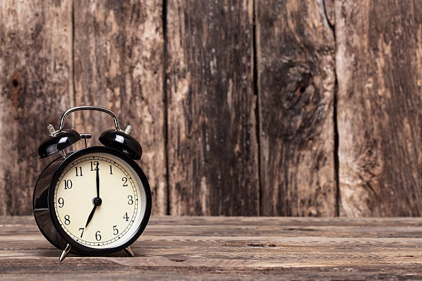 Black retro clock showing 07:00 am or pm