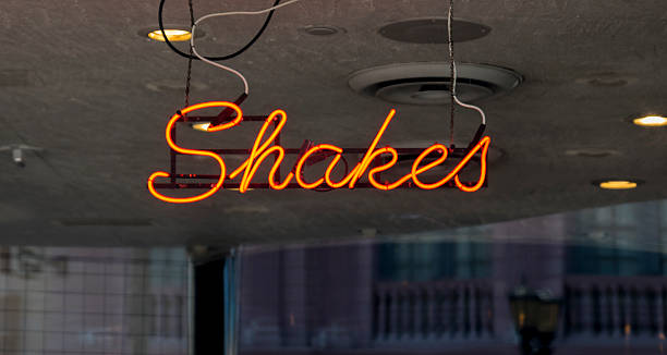 istock An illuminated neon Shake sign - milkshake 625442150