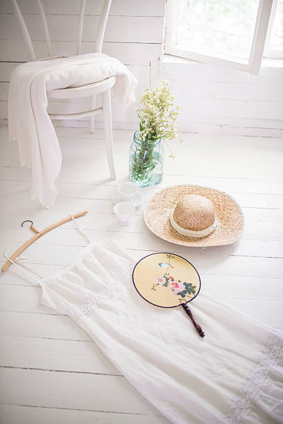 istock White summer dress and straw hat. 625443976
