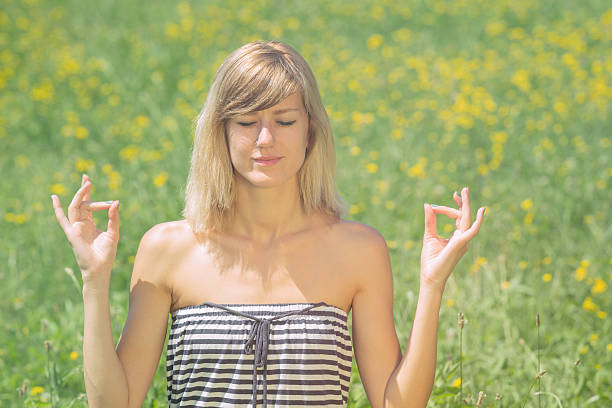 istock Girl relaxing in the field. 625444872