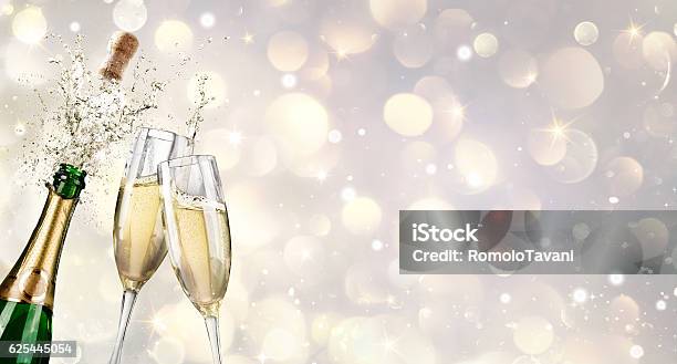 Champagne Explosion With Toast Of Flutes Stock Photo - Download Image Now - Champagne, Celebratory Toast, New Year