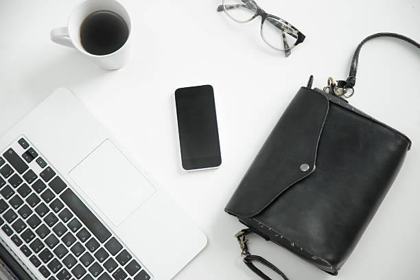 istock White office desk with keyboard, glasses, coffee, mobile phone, 625451272