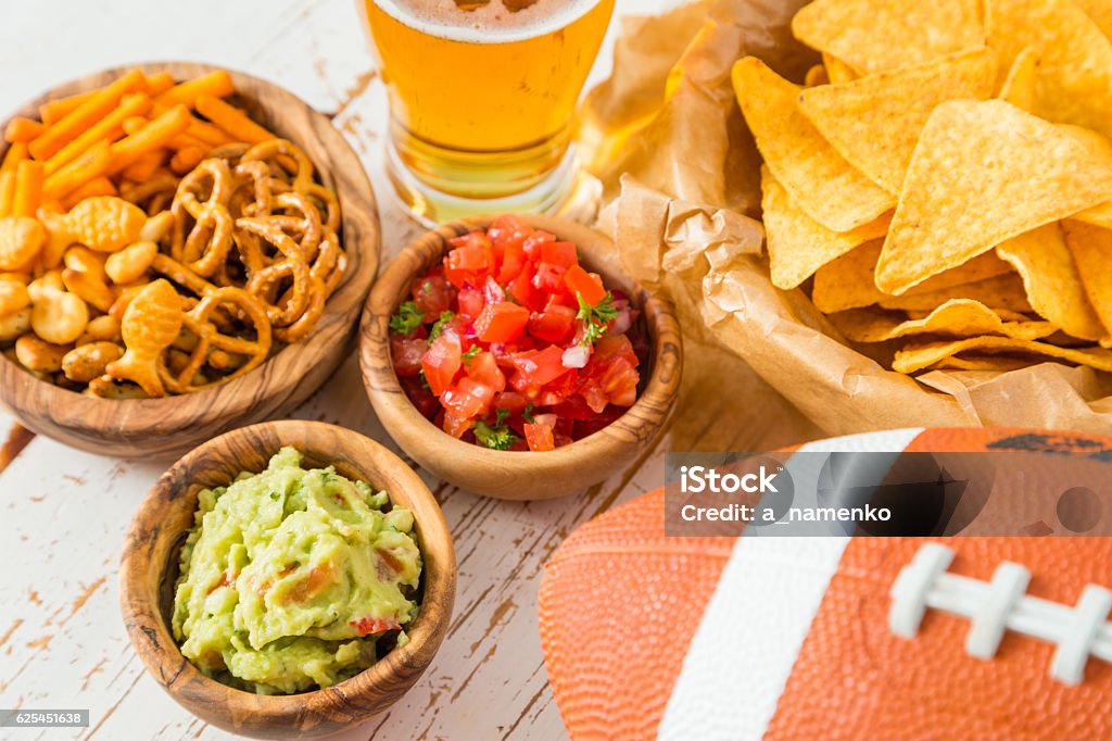 Football party food, nachos salsa guacamole Football party food,  nachos salsa guacamole, copy space Party - Social Event Stock Photo