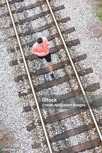 Jogging On Railroad Tracks Stock Photo - Download Image Now - Jogging, Men, Active Lifestyle