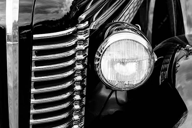 istock Grill of an antique car with front head light 625452338