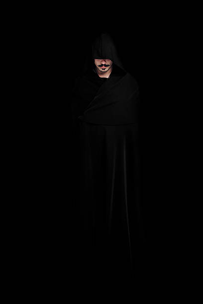 istock Mysterious man in a black cloak 625452340